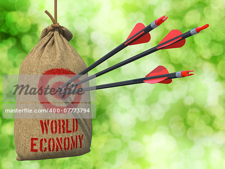 World Economy - Three Arrows Hit in Red Target on a Hanging Sack on Green Bokeh Background. World Economy - Three Arrows Hit in Red Target on a Hanging Sack on Green Bokeh Background.
