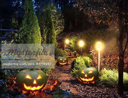 Illuminated home garden path patio lights with halloween pumpkin lanterns