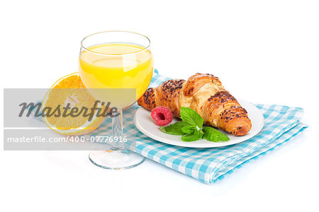 Orange juice and fresh croissant. Isolated on white background