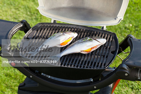 Fresh dorado fish grill cooking outdoors