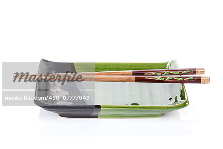 Chopsticks and plate for japanese food. Isolated on white background