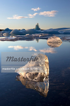 View of icebergs on Jokulsarlon, a glacial lagoon at the head of the Breidamerkurjokull Glacier, with some icebergs illuminated by the afternoon winter sun, on the edge of the Vatnajokull National Park, South Iceland, Iceland, Polar Regions