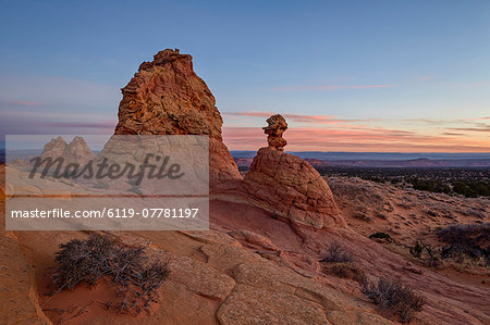 Sandstone formations at dawn with pink clouds, Coyote Buttes Wilderness, Vermilion Cliffs National Monument, Arizona, United States of America, North America