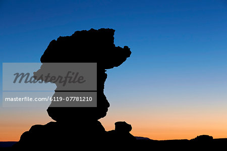 Silouetted sandstone formation at dawn, Coyote Buttes Wilderness, Vermilion Cliffs National Monument, Arizona, United States of America, North America