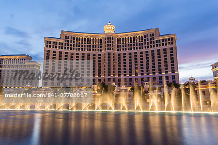 Bellagio at dusk with fountains, The Strip, Las Vegas, Nevada, United States of America, North America