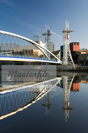 The Millennium Bridge reflected in the Manchester Ship Canal, Salford Quays, Salford, Greater Manchester, England, United Kingdom, Europe