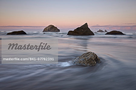 Rock, sea stacks and waves at dawn, Bandon Beach, Oregon, United States of America, North America