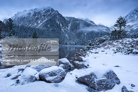 Popradske Pleso lake and mountain cottage in wintertime, Slovakia, Europe