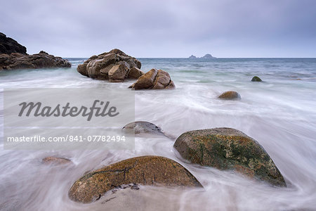 Waves wash over the beach at Porth Nanven near Land's End, Cornwall, England, United Kingdom, Europe