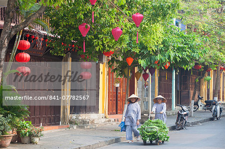 Woman pushing trolley of vegetables along street, Hoi An, UNESCO World Heritage Site, Quang Nam, Vietnam, Indochina, Southeast Asia, Asia