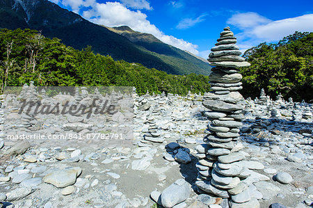 Man made stone pyramids at the Blue Pools, Haast Pass, South Island, New Zealand, Pacific