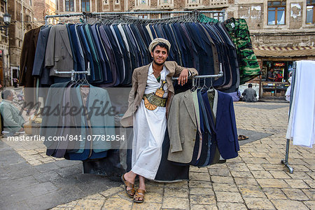 Man selling clothes in the Old Town, UNESCO World Heritage Site, Sanaa, Yemen, Middle East