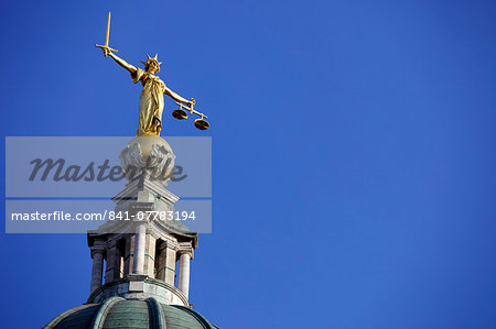 Scales of Justice above the Old Bailey Law Courts (Central Criminal Court) on former site of Newgate Prison, London, England, United Kingdom, Europe