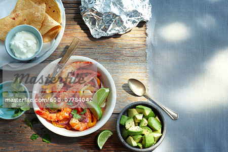 Overhead View of Corn Tortillas, Shrimp, Avocado and Sour Cream Overhead View of Corn Tortillas, Shrimp, Avocado and Sour Cream