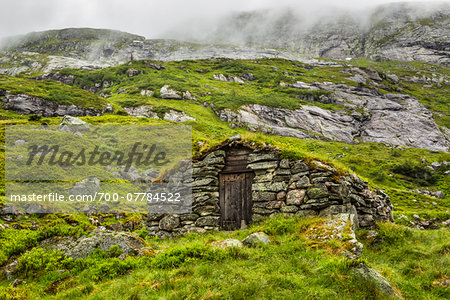 Stone Houses with Sod Roofs along Gaularfjellet National Tourist Route between Balestrand and Moskog, Sogn og Fjordane, Norway Stone Houses with Sod Roofs along Gaularfjellet National Tourist Route between Balestrand and Moskog, Sogn og Fjordane, Norway