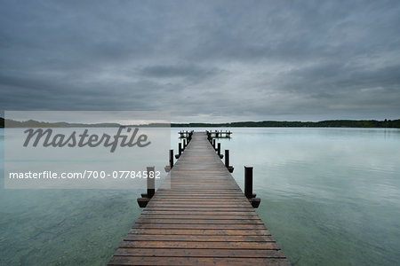 Wooden jetty on Lake Worthsee, Fuenfseenland, Upper Bavaria, Germany