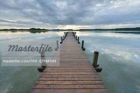 Wooden jetty on Lake Worthsee, Fuenfseenland, Upper Bavaria, Germany