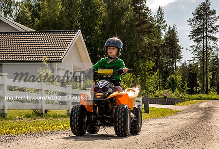 Boy on four-wheeler, Orebro, Sweden