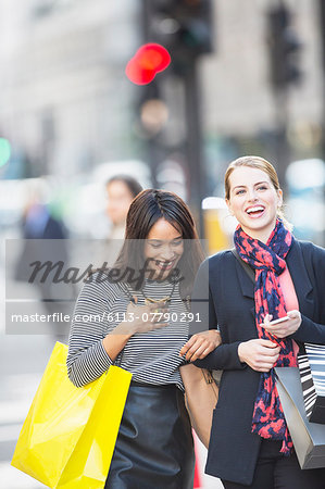Women walking together on city street