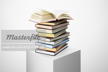 Stack of books on pedestal Stack of books on pedestal