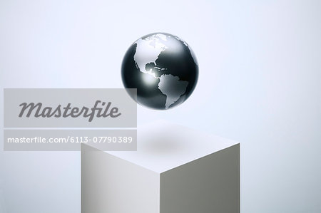 Globe hovering over pedestal