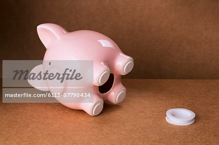 Empty piggy bank with stopper on counter