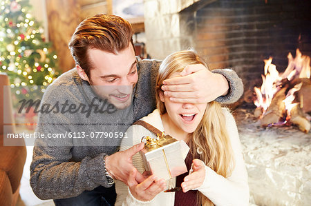 Couple exchanging gifts on Christmas