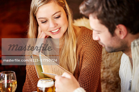 Couple looking at restaurant menu together