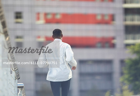 Man running through city street