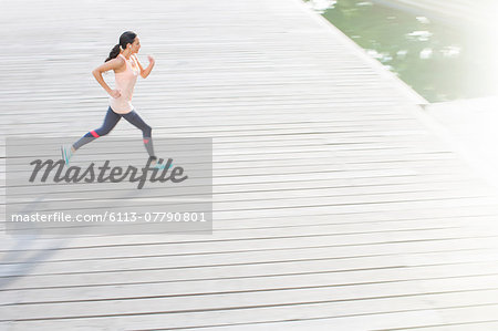 Woman running through city streets