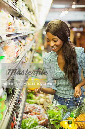 Woman shopping in grocery store Woman shopping in grocery store