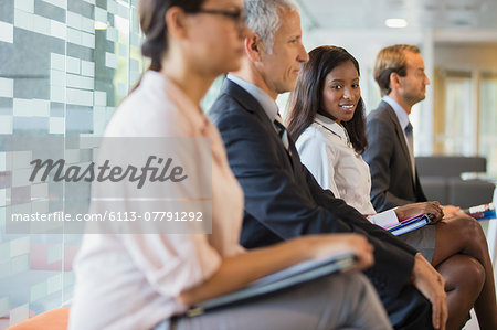 Business people sitting in office together