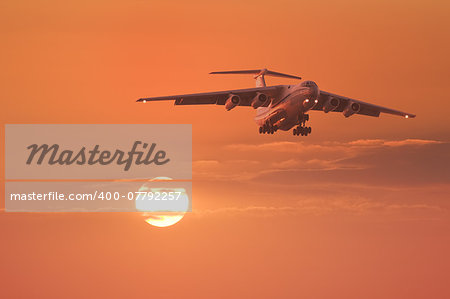 Landing of the plane at sunset.