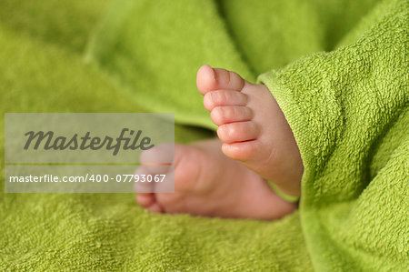 Close-up of Newborn Baby feet under blanket