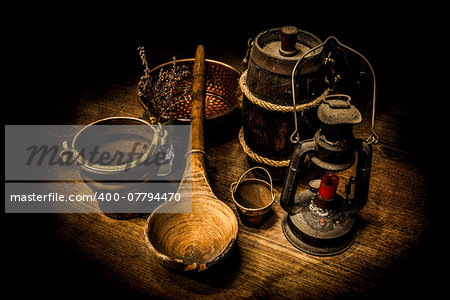 Old and rusty kitchen tools on a wooden table