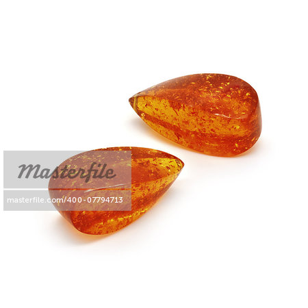 Beautiful amber drops briolette on a white background.