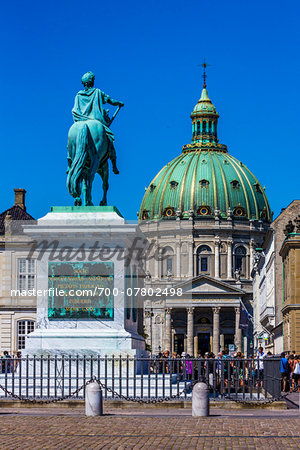 Statue of King Frederik V in Amalienborg Palace Square with Frederik's Church (known as The Marble Church) in the background, Frederiksstaden, Copenhagen, Denmark