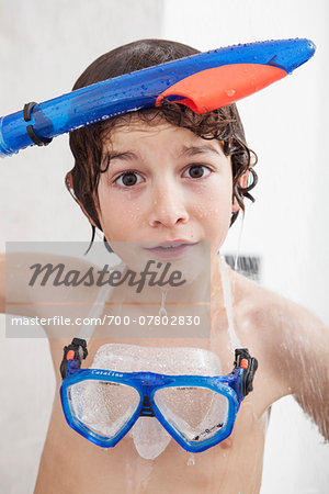 Boy Standing in Shower with Diving Mask and Snorkel