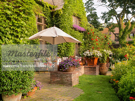 View of private garden and patio of home in summer, Toronto, Ontario, Canada