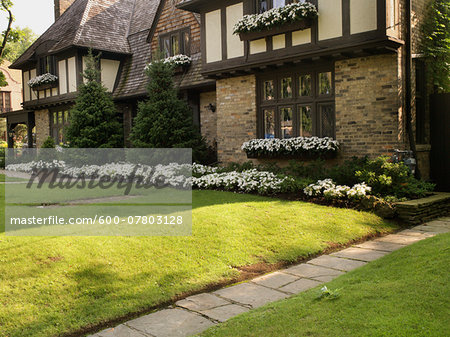 View of house exterior and front garden in summer, Toronto, Ontario, Canada