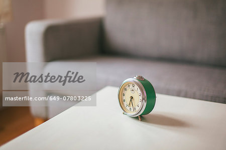 Alarm clock on coffee table in living room