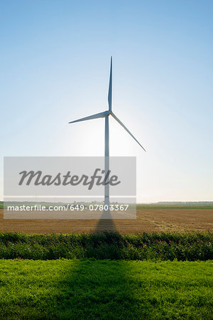 Wind turbine in front of sunrise in field landscape, Rilland, Zeeland, the Netherlands