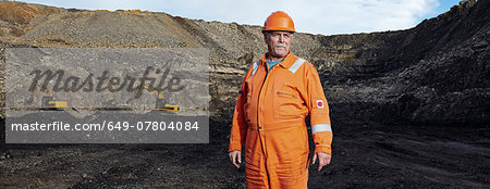 Portrait of mature quarry worker in quarry site Portrait of mature quarry worker in quarry site