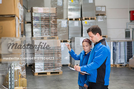 Factory workers checking pallets