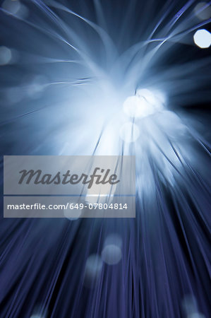Close up of illuminated fiber optic light exploding outwards Close up of illuminated fiber optic light exploding outwards