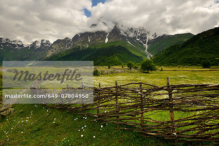 Hand woven fence and distant mountains, Mazeri village, Svaneti, Georgia