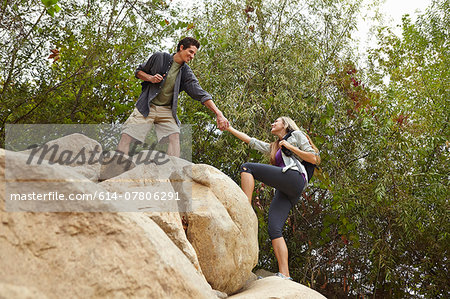 Couple rock climbing