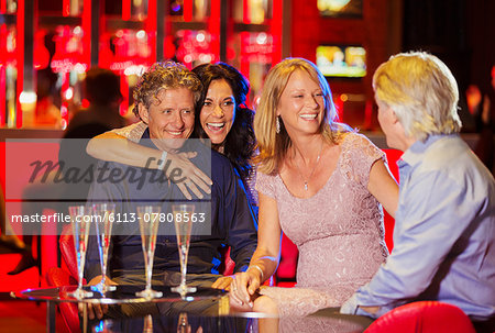 Group of friends having fun in bar