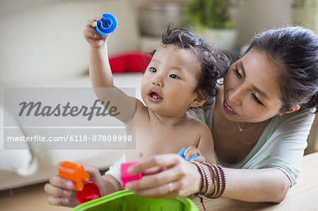 Mother playing with her baby boy.