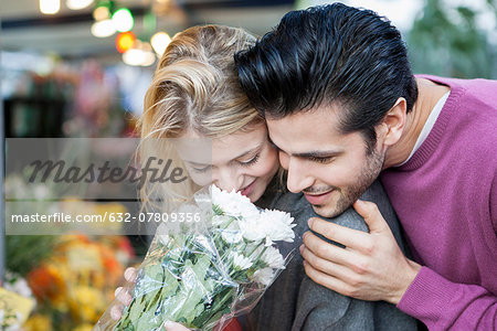 Young couple with flower bouquet